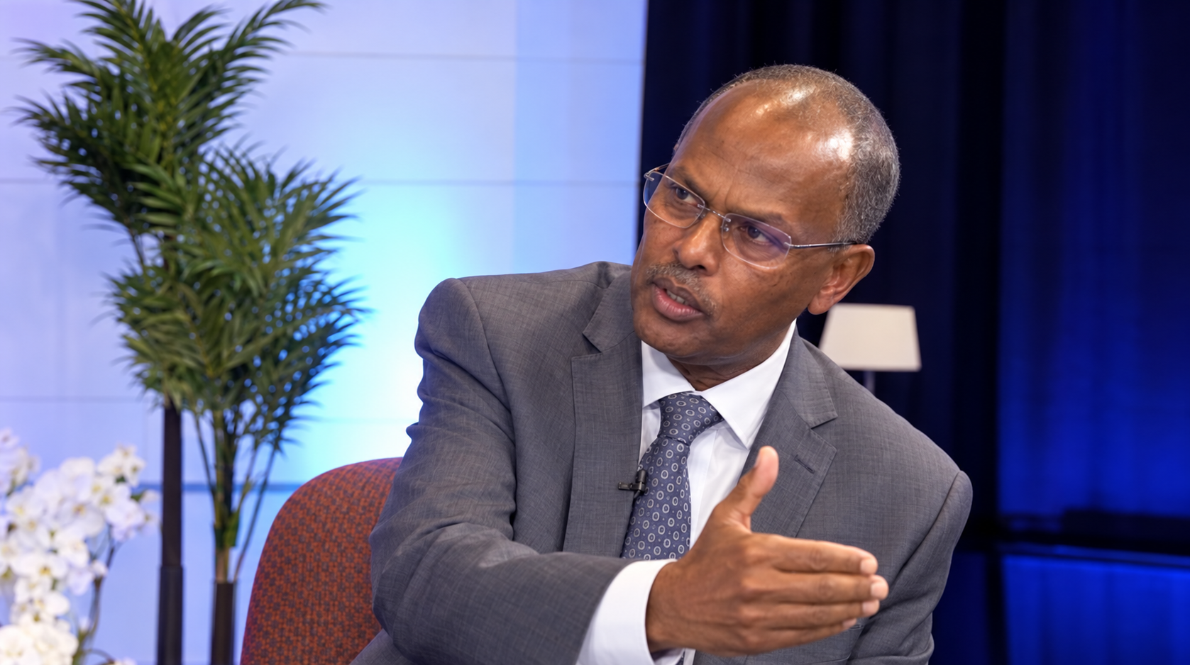 Enhanced portrait of Dr. Mohamud Ali Geeldoon speaking during a discussion