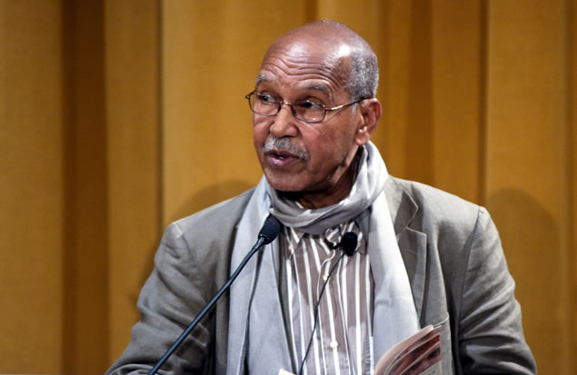 Nuruddin Farah speaking at a microphone